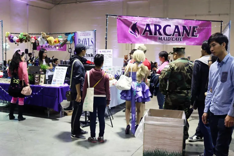 An early Arcane Maid Café pop-up booth with maids at an anime event