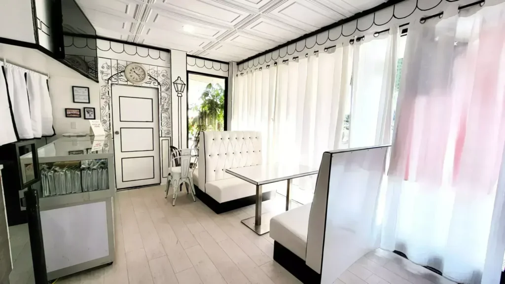 Booth seating and curtains inside Arcane Maid Café