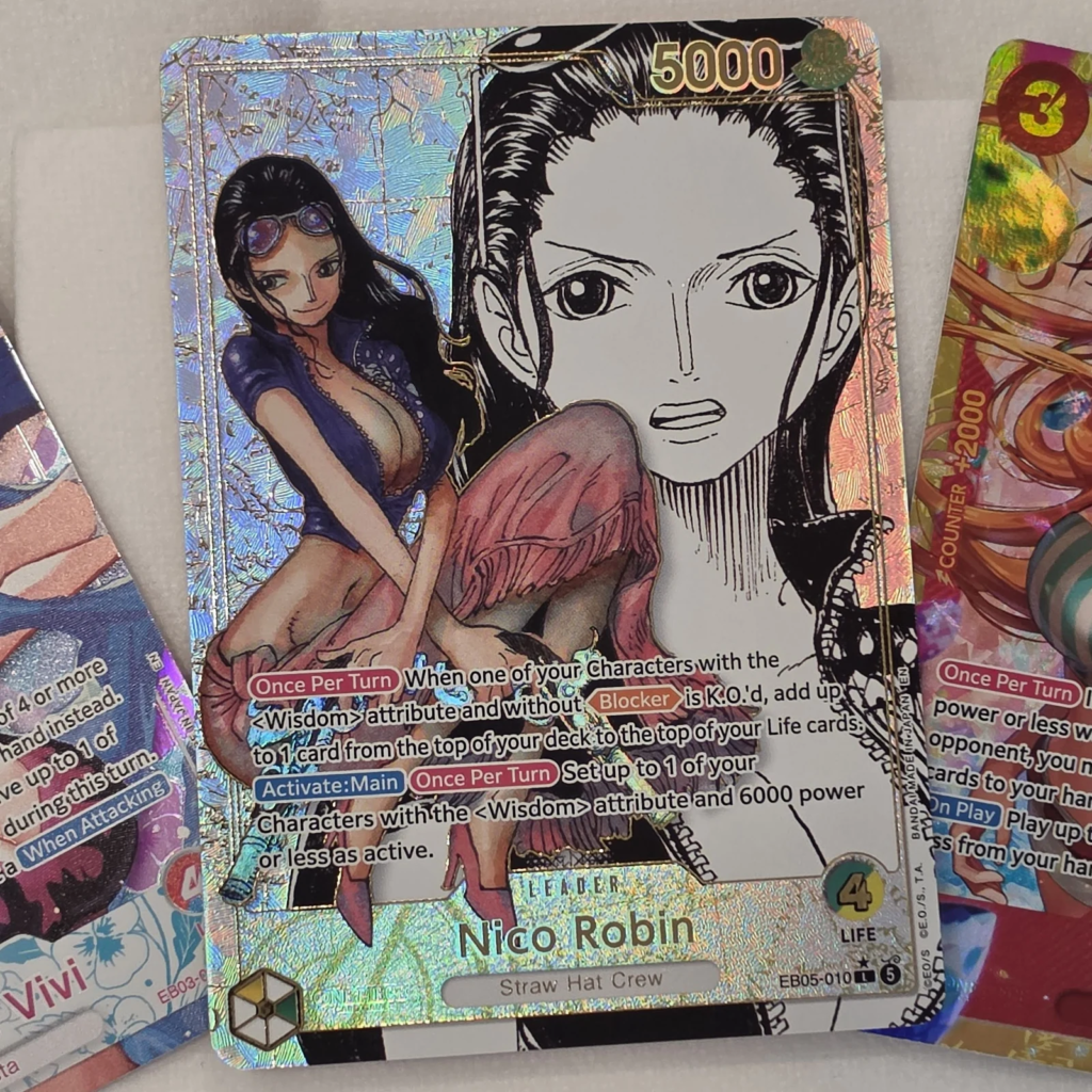 Nico Robin Leader EB05-010 Super Leader Alternate Art, Green/Yellow Leader with manga-style black and white face in a silver holo textured frame, One Piece Card Game EB-05 Heroines Edition vol.2 pull at Arcane Maid Cafe, Arcadia CA