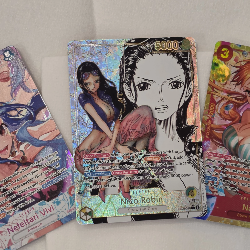 Nico Robin Leader EB05-010 Super Leader Alternate Art manga art pulled on EB-05 launch day, with Nefeltari Vivi EB03-001 Heroine Leader and Nami EB05-061 Secret Rare, One Piece Card Game EB-05 Heroines Edition vol.2 pulls at Arcane Maid Cafe, Arcadia CA