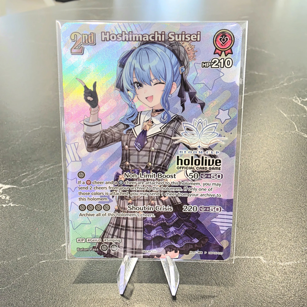Hoshimachi Suisei 2nd hBP05-037 Bloom Cup promo (Not for Sale), hololive OCG Suisei Cup champion prize card with holo foil and Bloom Cup stamp, on display at Arcane Maid Cafe, Arcadia CA